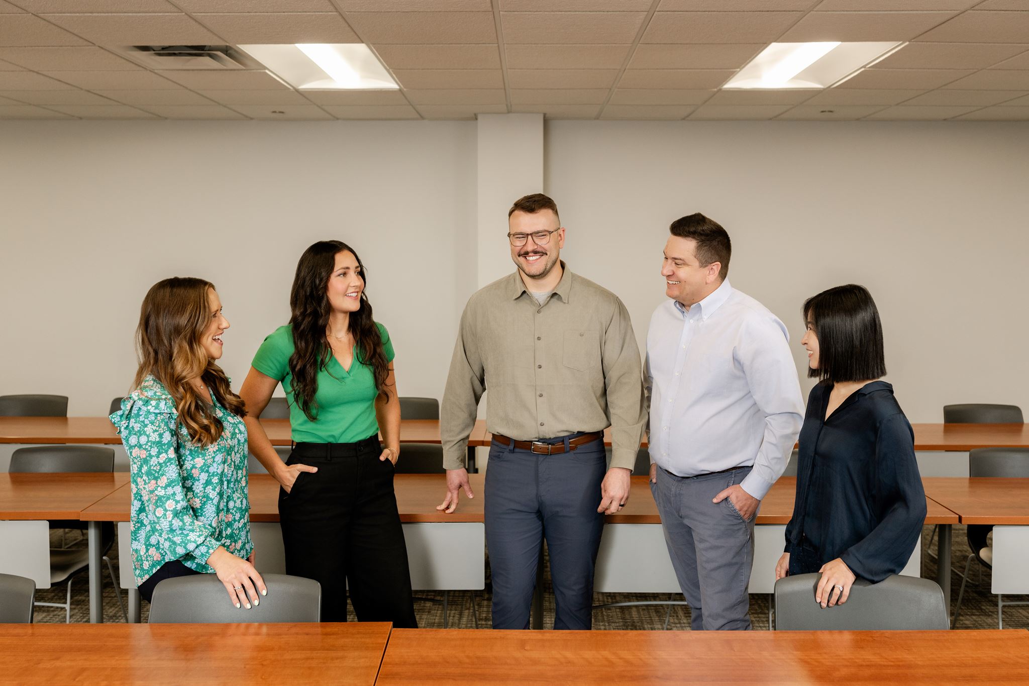 Meriwether employees gathered around a desk