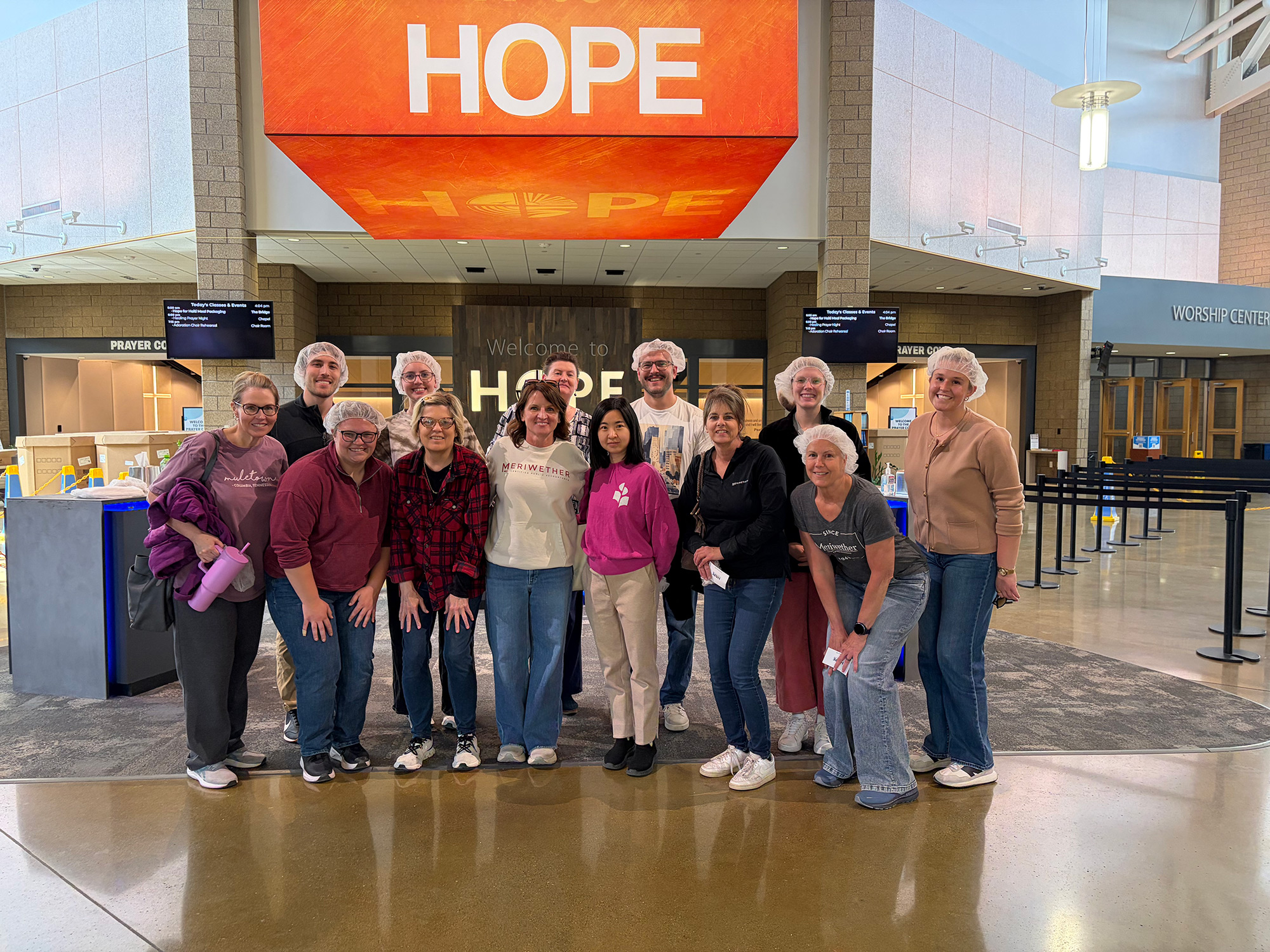 Perry-&-WDM--Meal-Packaging-at-Lutheran-Church-of-Hope Meriwether employees at a meal packaging for Hope Lutheran Church