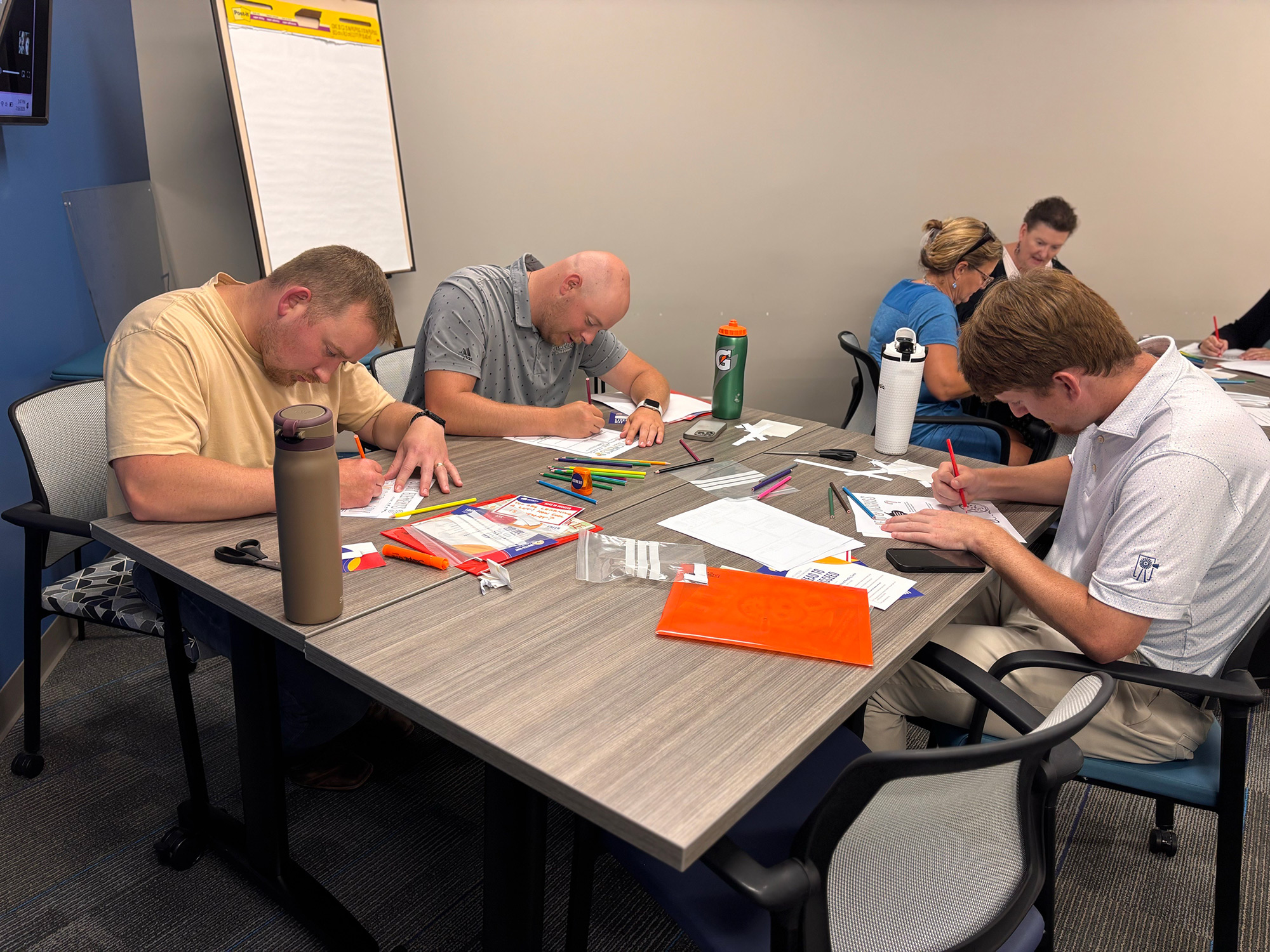 WDM--United-Way-Literacy-Kits-Coloring Meriwether employees fill literacy kits for the United Way