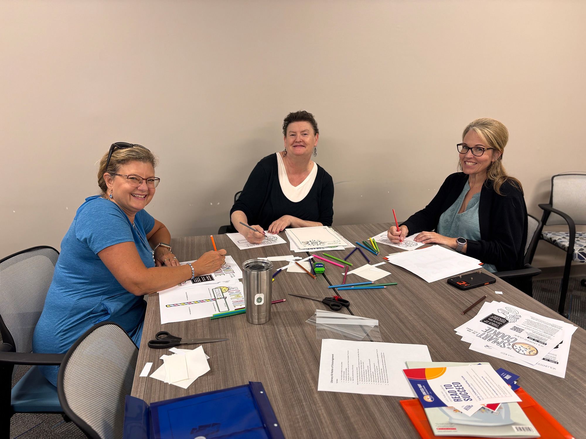 WDM--United-Way-Literacy-Kits_ Meriwether employees fill literacy kits for children in need